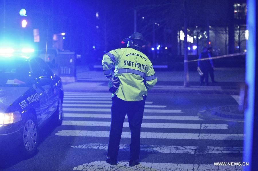 Policemen blank off the Massachusetts Institute of Technology (MIT) campus in Boston, the United States, April 19, 2013. The police officer who was shot on the MIT campus in Boston Thursday night has died, CNN reported on Thursday. (Xinhua/Zhang Jun)