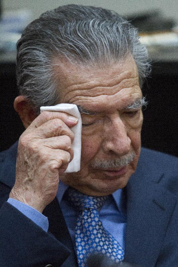 Former Guatemalan dictator, retired General Jose Efrain Rios Montt, listens as Guatemalan judge Carol Patricia Flores announces that she is dropping his genocide trial, at the Supreme Court of Justice, in Guatemala City, capital of Guatemala, on April 18, 2013. Judge Carol Patricia Flores announced Thursday that she was dropping the genocide trial against former dictator Efrain Rios Montt due to a pending appeal, according to local press. (Xinhua/Luis Echeverria)