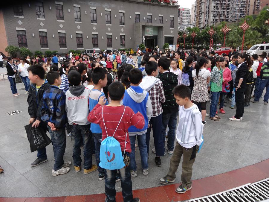 Students gather outside their teaching buildings to avoid aftershocks of a quake, in Dazhou City of southwest China's Sichuan Province, April 20, 2013. A 7.0-magnitude earthquake hit Lushan County of Sichuan Province at 8:02 a.m. Beijing Time (0002 GMT) on Saturday, according to the China Earthquake Networks Center (CENC). The epicenter, with a depth of 13 kilometers, was monitored at 30.3 degrees north latitude and 103.0 degrees east longitude. (Xinhua/Deng Liangkui)