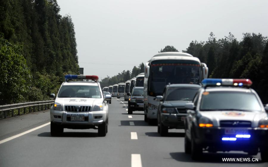 A rescue team heads to the Lushan earthquake areas on the Jingkun Expressway in southwest China's Sichuan Province April 20, 2013. A 7.0-magnitude earthquake hit Sichuan Province's Lushan County of Ya'an City Saturday morning. A total of 37 people were dead so far and at least 400 others injured in the earthquake. (Xinhua/Bai Xuefei) 