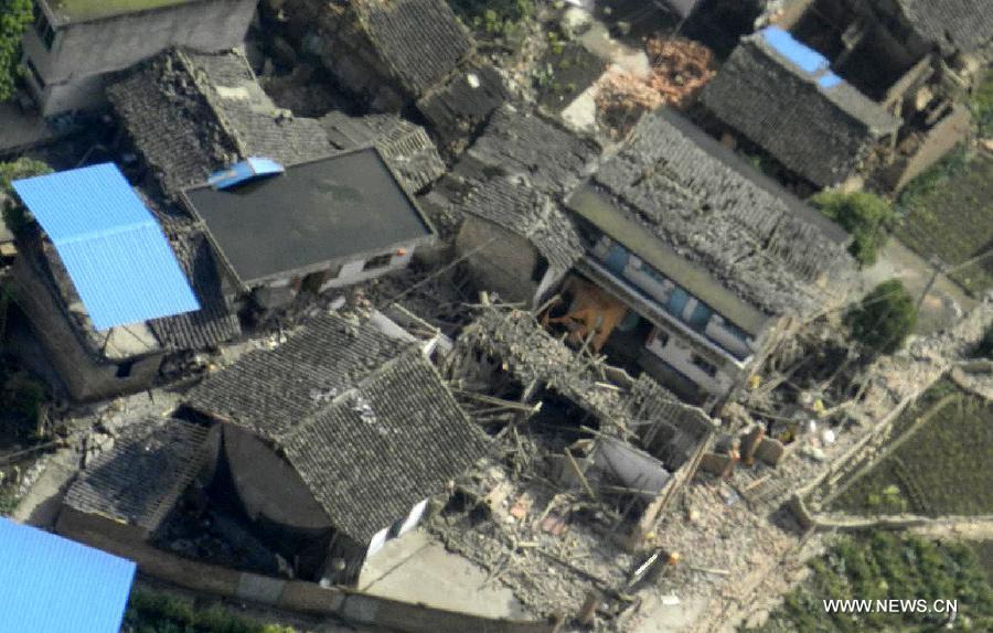 The bird eye view photo taken on a helicopter shows the quake-destroyed houses in Taiping Town of Lushan County in Ya'an City, southwest China's Sichuan Province, April 20, 2013. A 7.0-magnitude earthquake hit Sichuan Province's Lushan County of Ya'an City Saturday morning. Fifty-six people were dead so far and more than 400 others injured in the earthquake. (Xinhua/Liu Yinghua) 
