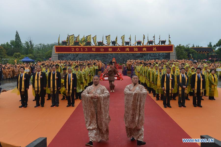 Worshippers present offerings during a memorial ceremony in honor of Da Yu, a legendary Chinese hero who tamed the Yellow River and made it beneficial to farming in the prehistorical era, held in Shaoxing City, east China's Zhejiang Province, April 20, 2013. (Xinhua/Yuan Yun)