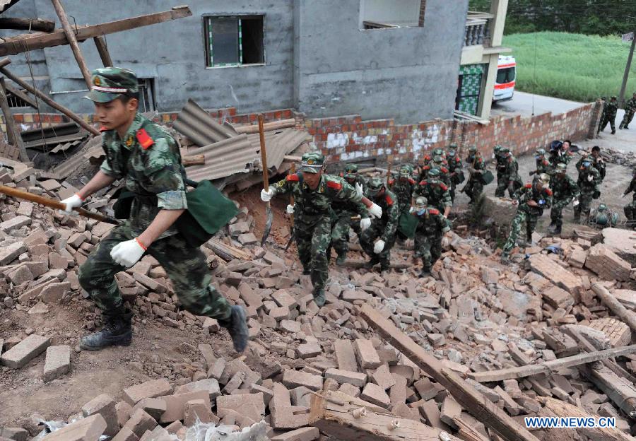 Rescuers conduct rescue work in quake-hit Qingren Township, Lushan County