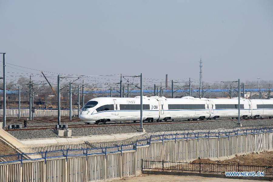A Harbin-Dalian high-speed train arrives at the Changchun West Railway Station in Changchun, capital of northeast China's Jilin Province, April 21, 2013. The Harbin-Dalian High-speed Railway, the world's fastest railway in frigid regions, started its summer schedule as of April 21, with the speed during the summer period (usually from April to November) lifted to 300 kilometers per hour from 200 in the winter period, cutting the shortest running time between Harbin and Dalian from five hours and 18 miniutes to three and half hours. The Harbin-Dalian high-speed railway was open for service on Dec. 1, 2012. (Xinhua/Lin Hong)