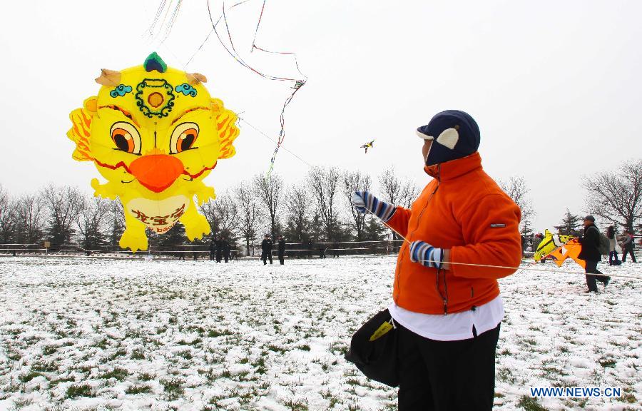 Participants fly kites at the 30th Weifang International Kite Festival in Weifang, east China's Shandong Province, April 20, 2013. Kite-making in Weifang, known as "Kite Capital," can be traced back to the late 16th century and the early 17th century. (Xinhua/Zhang Chi)