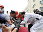 Doctors treat a wounded in hospital in Lushan