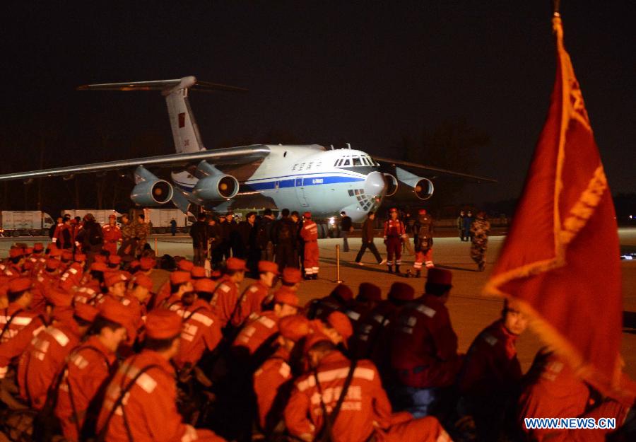 Members of China International Search and Rescue Team (CISAR) gather at Nanyuan Airport in Beijing, capital of China, April 20, 2013. A total of 140 rescuers and 12 sniffer dogs flew to the earthquake-hit Lushan County, southwest China's Sichuan Province, Saturday night to conduct rescue work. (Xinhua/Yu Hongchun) 