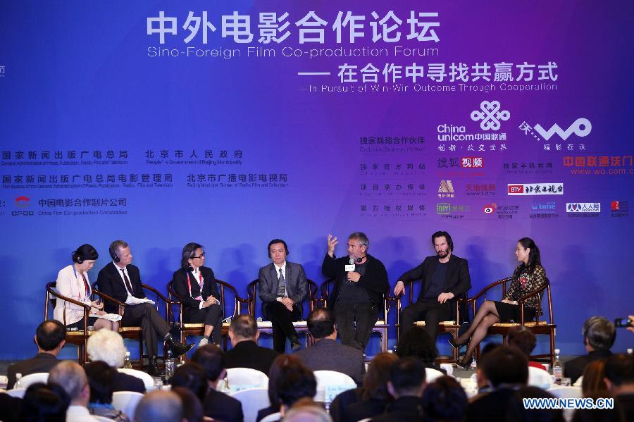 Film director Luc Besson (3rd R) talks at the Sino-Foreign Film Co-production Forum in Beijing, capital of China, April 21, 2013. (Xinhua/Yang Le)