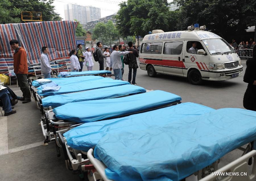 Stretchers are seen outside the Huaxi Hospital of Sichuan University to carry quake victims in Chengdu, capital of southwest China's Sichuan Province, April 22, 2013. The hospital opened a green channel for victims after a 7.0-magnitude earthquake jolted Lushan County of Ya'an City in Sichuan on April 20 morning. As of 12 a.m. on April 22, the hospital has received 229 injured people. (Xinhua/Li Ziheng)  