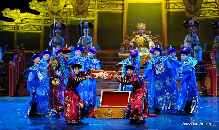 Artists of the Jilin Provincial Performing Troupe perform during a stage show at the Oriental Theatre in Changchun, capital of northeast China's Jilin Province, April 22, 2013. The show, with various art forms including singing, dancing, acrobatics and conjuring, displays folk customs in the Changbai Mountain area. (Xinhua/Xu Chang) 