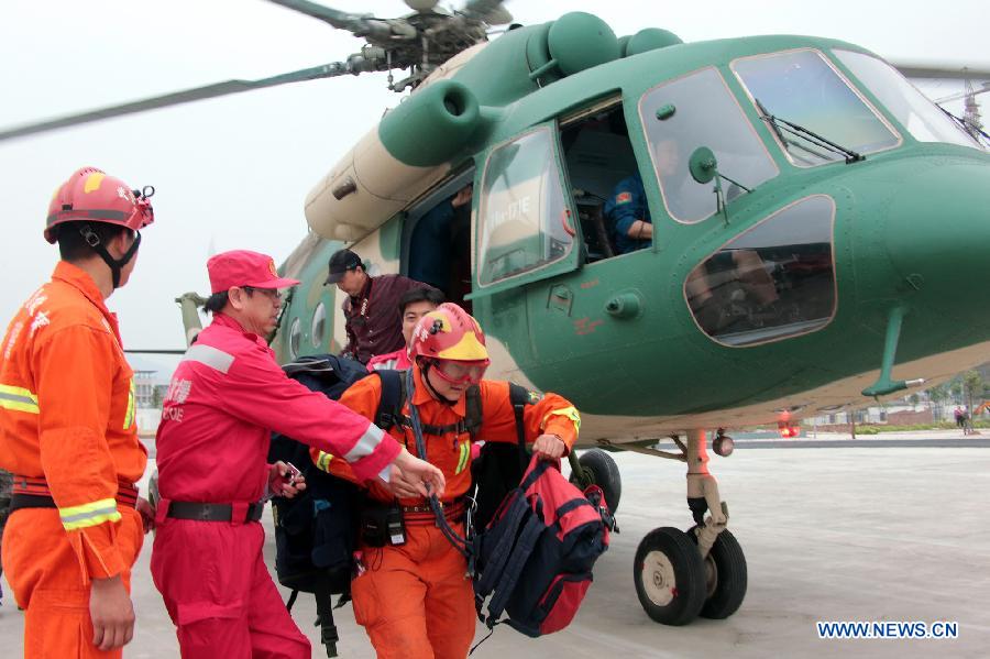 Rescuers get off a helicopter after arriving in quake-hit Ya'an City, southwest China's Sichuan Province, April 21, 2013. A 7.0-magnitude quake jolted Lushan County of Ya'an on Saturday morning. (Xinhua/Li Gang) 