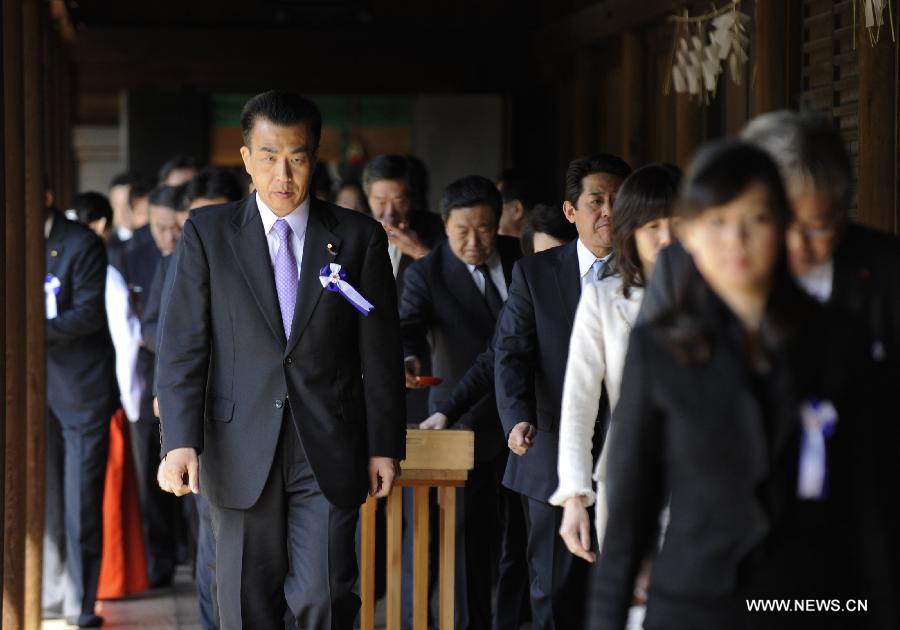 Japanese lawmakers head to visit the Yasukuni Shrine in Tokyo, Japan, on April 23, 2013. Despite repeated strong opposition from China, a group of 168 Japanese lawmakers on Tuesday visited the controversial war-link Yasukuni Shrine in Tokyo, which honors Japanese war criminals of World War II. It marked the first time that the Japanese lawmakers' number exceeded 100 since October 2005, according to local media. (Xinhua) 