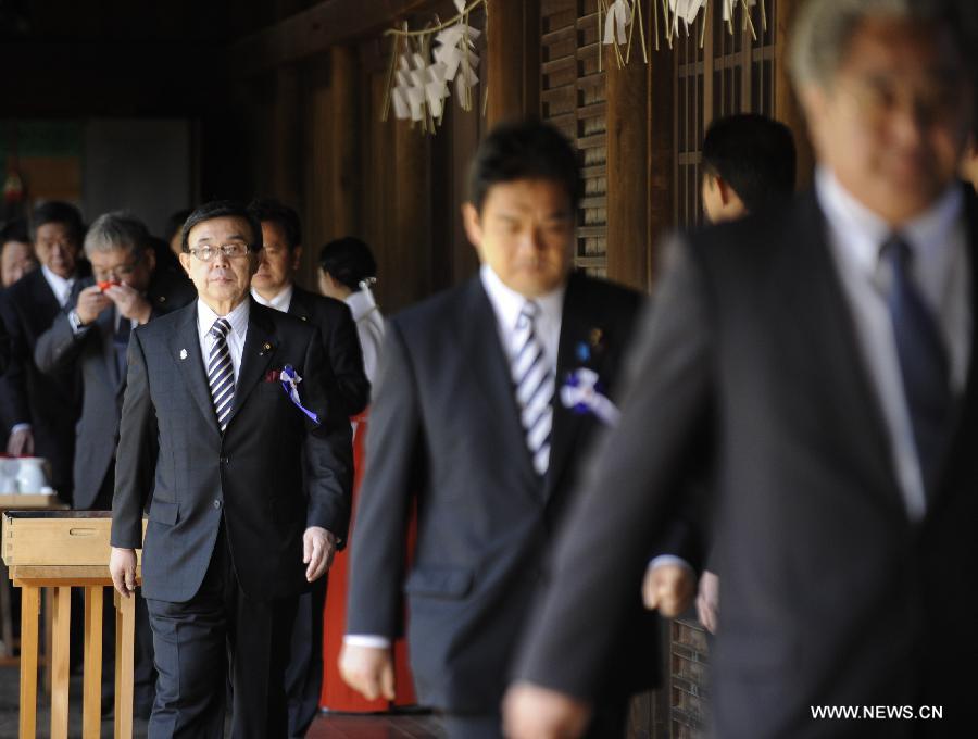 Japanese lawmakers are ready to leave after visiting the Yasukuni Shrine in Tokyo, Japan, on April 23, 2013. Despite repeated strong opposition from China, a group of 168 Japanese lawmakers on Tuesday visited the controversial war-link Yasukuni Shrine in Tokyo, which honors Japanese war criminals of World War II. It marked the first time that the Japanese lawmakers' number exceeded 100 since October 2005, according to local media. (Xinhua) 