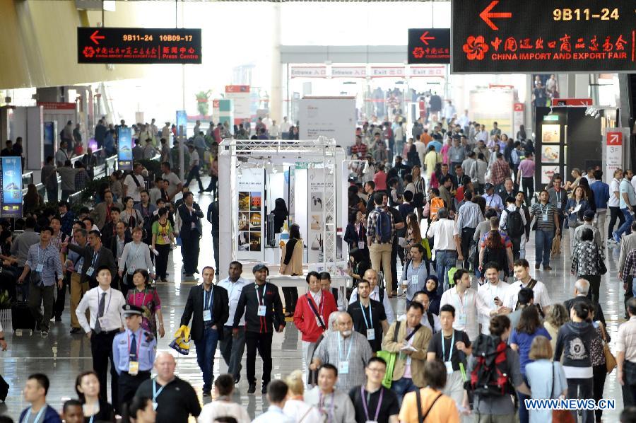 Visitors walk around the exhibition area of the second phase of the 113th Canton Fair, or China Import and Export Fair, in Guangzhou, capital of south China's Guangdong Province, April 23, 2013. The phase 2 of the fair will last five days from April 23 to 27, presenting consumer goods, home decorations and gifts. (Xinhua/Liang Xu)