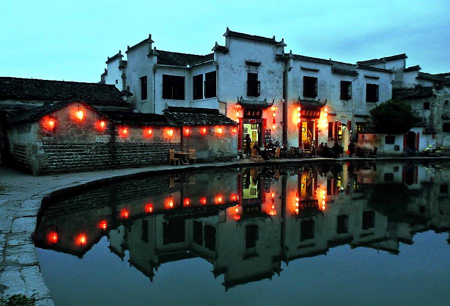 Photo taken on April 21, 2013 shows the night scenery at the Yuezhao Scenic Spot of Hongcun Village in Yixian County, east China's Anhui Province. (Xinhua/Wang Song)