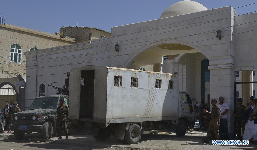 Yemeni soldiers escort a police van carrying al-Qaeda militants to enter a state security court in Sanaa, Yemen, on April 23, 2013. According to the official Saba News Agency, the Yemeni security court sentenced ten Yemenis to jail terms ranging from four to 6 years after convicting them of belonging to al-Qaeda in the Arabian Peninsula and forming armed terror gangs to carry out attacks against Yemeni and foreign interests. (Xinhua/Mohammed Mohammed) 