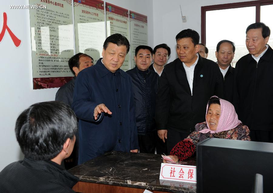 Liu Yunshan, a member of the Standing Committee of the Political Bureau of the Communist Party of China (CPC) Central Committee and member of the Secretariat of the CPC Central Committee, inspects the work of grassroots organs of the CPC in Jinhua Village of Kunshan City, east China's Jiangsu Province, April 22, 2013. Liu Yunshan made an inspection tour in Jiangsu from April 20 to 22. (Xinhua/Rao Aimin) 