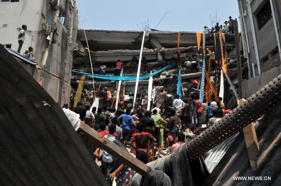Rescuers work at the collapsed building in Savar, Bangladesh, April 24, 2013. At least 70 people were killed and over six hundred injured after an eight-storey building in Savar on the outskirts of the Bangladeshi capital Dhaka collapsed on Wednesday morning. (Xinhua/Shariful Islam) 