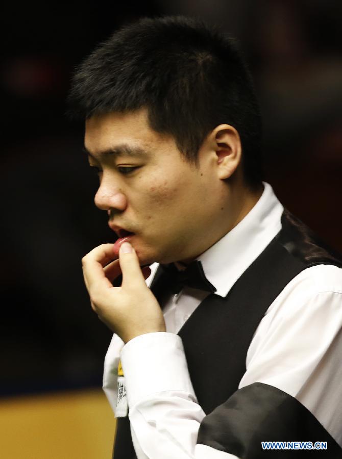 Ding Junhui of China reacts during his first round of World Snooker Championship against Alan McManus of Scotland at the Crucible Theatre in Sheffield, Britain, April 24, 2013. Ding won 10-5. (Xinhua/Wang Lili)