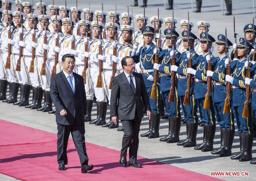 Chinese President Xi Jinping (front L) holds a welcoming ceremony for French President Francois Hollande (front R) in Beijing, capital of China, April 25, 2013. (Xinhua/Wang Ye)