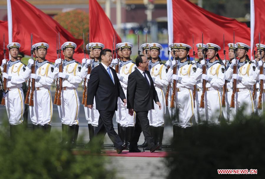 Chinese President Xi Jinping (L Front) holds a welcoming ceremony for French President Francois Hollande (R Front) in Beijing, capital of China, April 25, 2013. (Xinhua/Xie Huanchi)