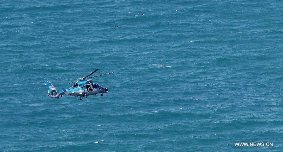 An Israeli air force helicopter operates next to a cruise ship off the coast of Haifa, northern Israel, Thursday, April 25, 2013. An Israeli Air Force F-16 fighter jet downed a drone off the coastline of the northern city of Haifa at noon of Thursday, the Israeli Defense Forces (IDF) said. (Xinhua/Jini) 