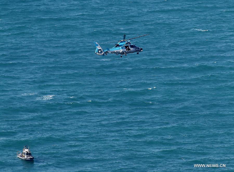 An Israeli air force helicopter operates next to a cruise ship off the coast of Haifa, northern Israel, Thursday, April 25, 2013. An Israeli Air Force F-16 fighter jet downed a drone off the coastline of the northern city of Haifa at noon of Thursday, the Israeli Defense Forces (IDF) said. (Xinhua/Jini)