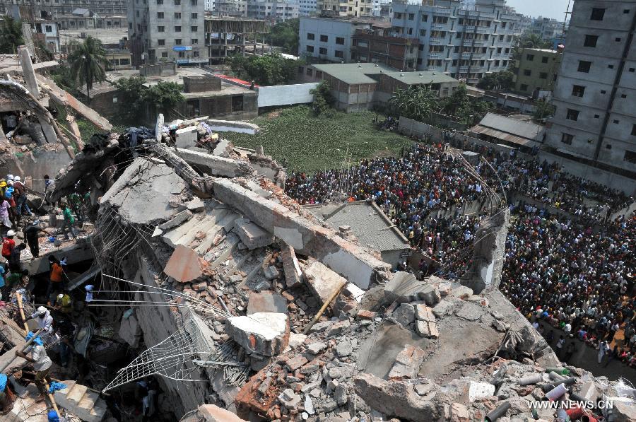 Photo taken on April 25, 2013 show the collapsed Rana Plaza building in Dhaka, Bangladesh. Rescue workers continued their struggle Thursday to reach many more who are feared trapped in the rubble one day after a building collapse in Savar on the outskirts of Bangladesh's capital Dhaka, with the death toll rising to 195. (Xinhua/Shariful Islam) 