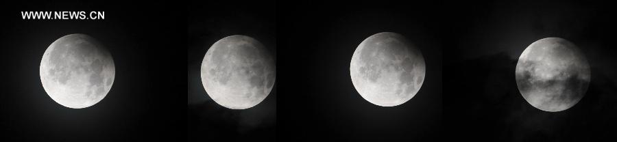 Combination photo taken on April 26, 2013 shows a partial lunar eclipse over the sky of Qionghai, south China's Hainan Province. The earth casts a shadow on the face of the moon and makes the partial lunar eclipse. (Xinhua/Meng Zhongde)