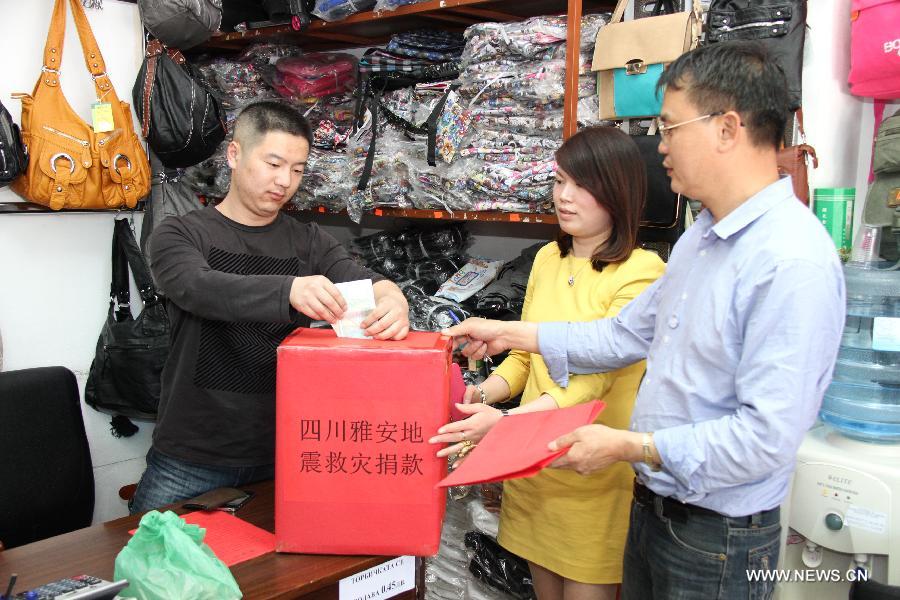 An overseas Chinese donates for the Chinese quake victims in Sofia, Bulgaria, April 25, 2013. Overseas Chinese in Bulgarian offered 41,030 Lev (about 2,7400 U.S. dollars) in donation to help the earthquake relief in southwest China's Sichuan Province. (Xinhua/Liu Zai) 