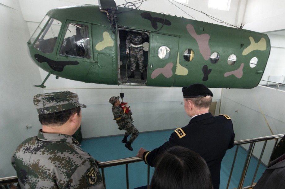 Gen. Martin Dempsey, the visiting chairman of the U.S. Joint Chiefs of Staff, visited the 4th Helicopter Regiment of the army aviation force of the Chinese People's Liberation Army (PLA), watched static display of the Mi-171 and the WZ-9 helicopters and viewed the flight performance of the WZ-10 and the WZ-9 helicopters on the morning of April 24, 2013. Afterwards, Gen. Dempsey successively visited the Army Aviation Force Academy of the PLA and the National Defense University (NDU) of the PLA and held discussions and exchanged views with the teaching and research staff and cadets representatives. (Xinhua)