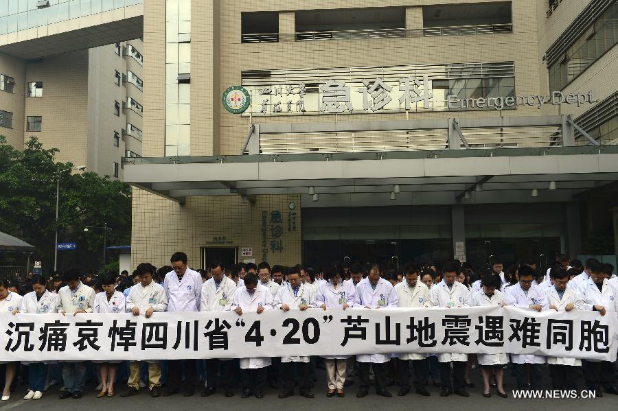 Medical workers mourn for those who died in a 7.0-magnitude quake a week ago, at the West China Hospital, Sichuan University, in Chengdu, capital of southwest China's Sichuan Province, April 27, 2013. Public mourning was held on Saturday morning in Sichuan Province for those who died in the earthquake on April 20. The quake, which jolted Lushan County of Ya'an City on April 20, has claimed nearly 200 lives. (Xinhua/Li Xiangyu) 