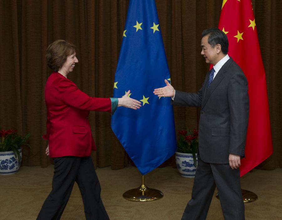 Chinese Foreign Minister Wang Yi (R) shakes hands with Catherine Ashton, High Representative of the European Union (EU) for Foreign Affairs and Security Policy, during their talks in Beijing, capital of China, April 27, 2013. (Xinhua/Xie Huanchi)
