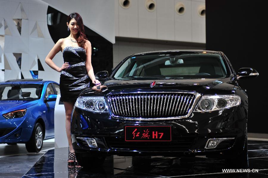 A model presents a Hongqi H7 car at the 2013 China (Tianjin) International Automobile Industry Exhibition in Tianjin, north China, April 27, 2013. The exhibition kicked off on Saturday, displaying over 500 vehicles. (Xinhua/Zhai Jianlan) 