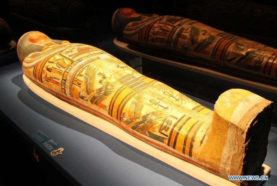 Photo taken on April 27, 2013 shows the cartonnage case of an ancient Egyptian mummy named Nesperennub at Singapore's Marina Bay Sands ArtScience Museum in Singapore. An exhibition named "Mummy: Secrets of the Tomb" opened to the public on Saturday, showing 100 artifacts and six mummies from the ancient Egyptian collection of the British Museum. (Xinhua/Hu Juanxin) 