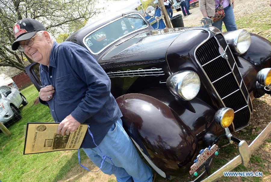 Owner poses with his vintage Plymouth car during an antique auto show in New York, the United States, on April 28, 2013. (Xinhua/Wang Lei)