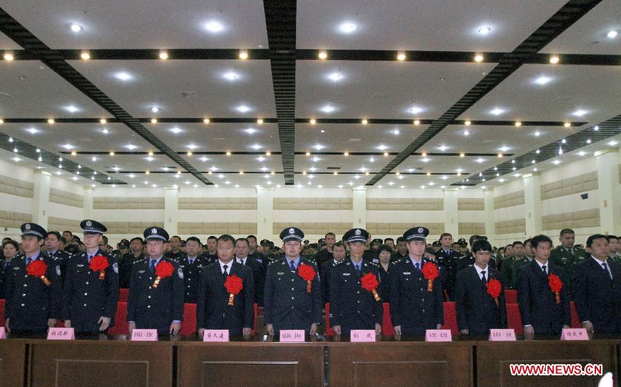 Photo taken on April 29, 2013 shows the scene of a commendation meeting held to award the 15 community workers and police officers who died during a terrorist clash on April 23 in Bachu County, Kashgar Prefecture, northwest China's Xinjiang Uygur Autonomous Region. The regional Communist Party of China (CPC) committee and government posthumously awarded the 15 individuals each as a "regional anti-terrorist hero," seven of whom were also posthumously awarded as a "regional outstanding CPC member". (Xinhua/Zhang Huawei)
