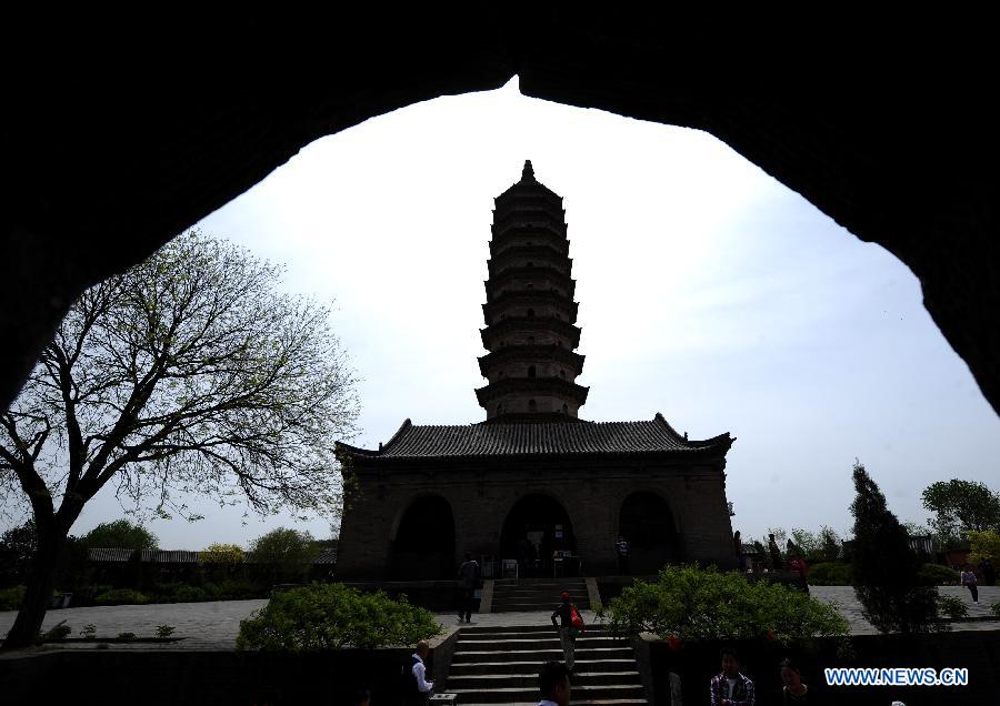 The Wenfeng Pagoda is pictured from the site of the Xuanwen Pagoda at the Yongzuo Temple in Taiyuan, capital of north China's Shanxi Province, April 29, 2013. The well preserved pagodas, namely Wenfeng Pagoda and Xuanwen Pagoda, have a history of 400 years. With the height exceeding 54 meters, the pagodas overlook the city's existing ancient architectures and have been dubbed as the cultural landmark of Taiyuan. (Xinhua/Yan Yan)