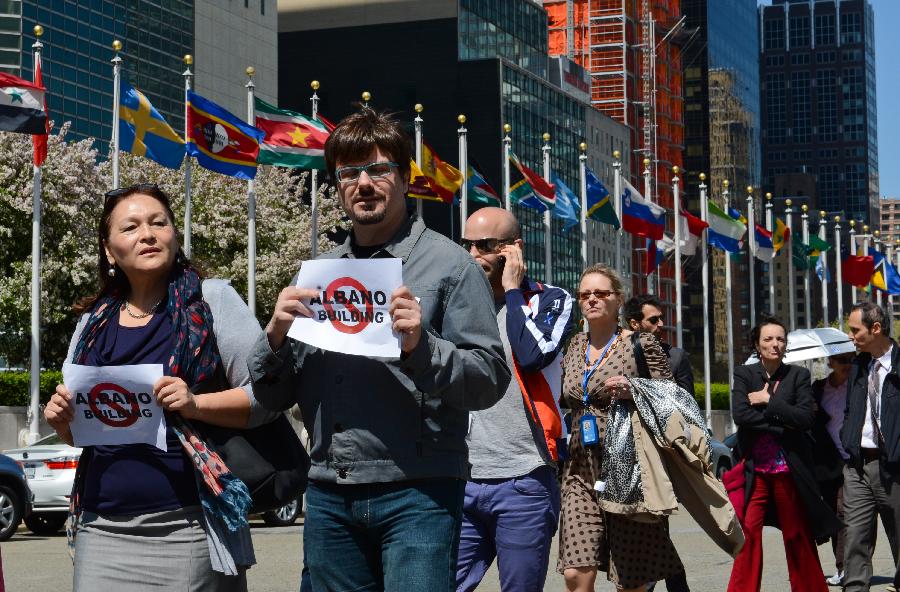 UN staff members take part in a protest demanding more decent working conditions, at the UN headquarters in New York, on May 1, 2013. (Xinhua/Niu Xiaolei) 