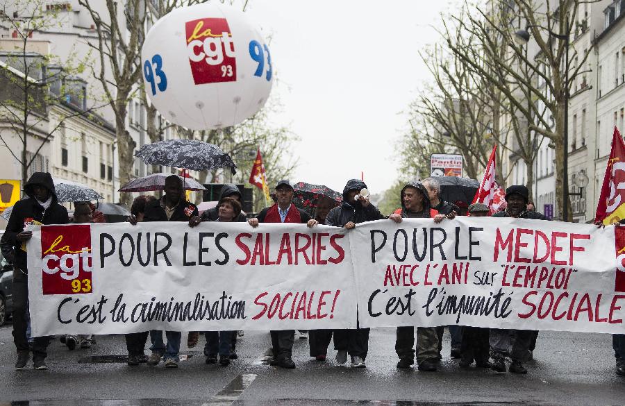 Demonstrators march in the annual May Day demonstration in Paris, France, May 1, 2013. (Xinhua/Etienne Laurent) 