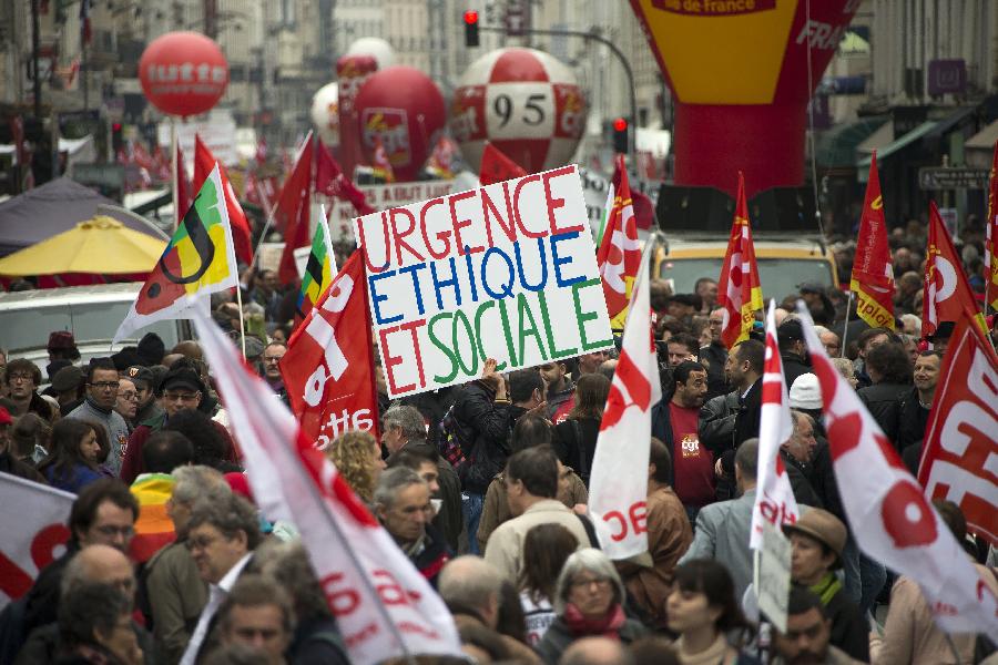 Demonstrators march in the annual May Day demonstration in Paris, France, May 1, 2013. (Xinhua/Etienne Laurent) 