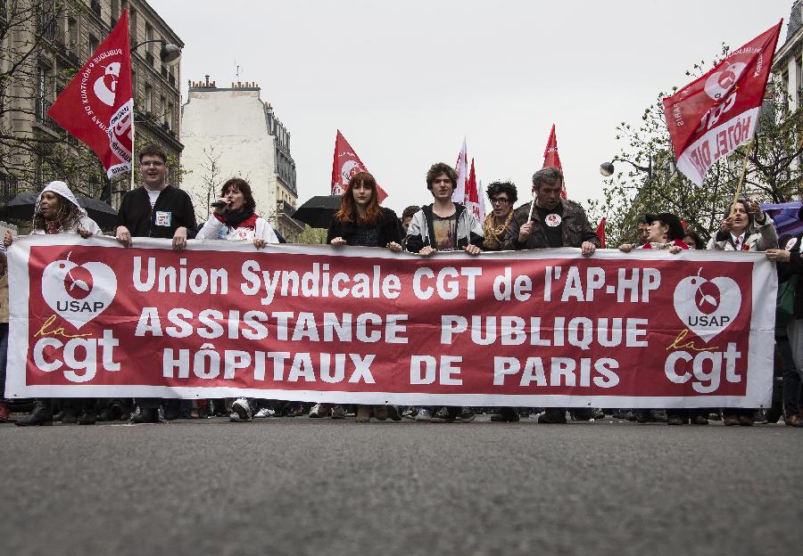 Demonstrators march in the annual May Day demonstration in Paris, France, May 1, 2013. (Xinhua/Etienne Laurent) 