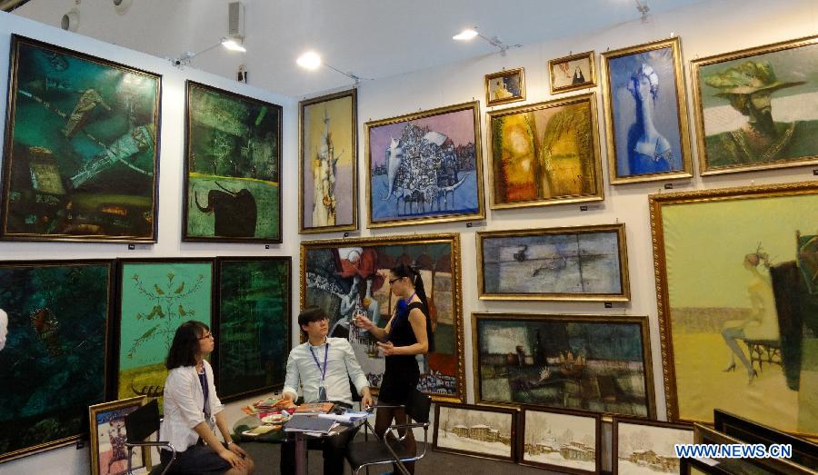 Foreign paintings are on display at the Art Beijing 2013 in Beijing, capital of China, May 1, 2013. Opened Wednesday at Agricultural Exhibition Center in Beijing, the annual art fair attracted some 150 participating art organizations. (Xinhua/Li Xin)