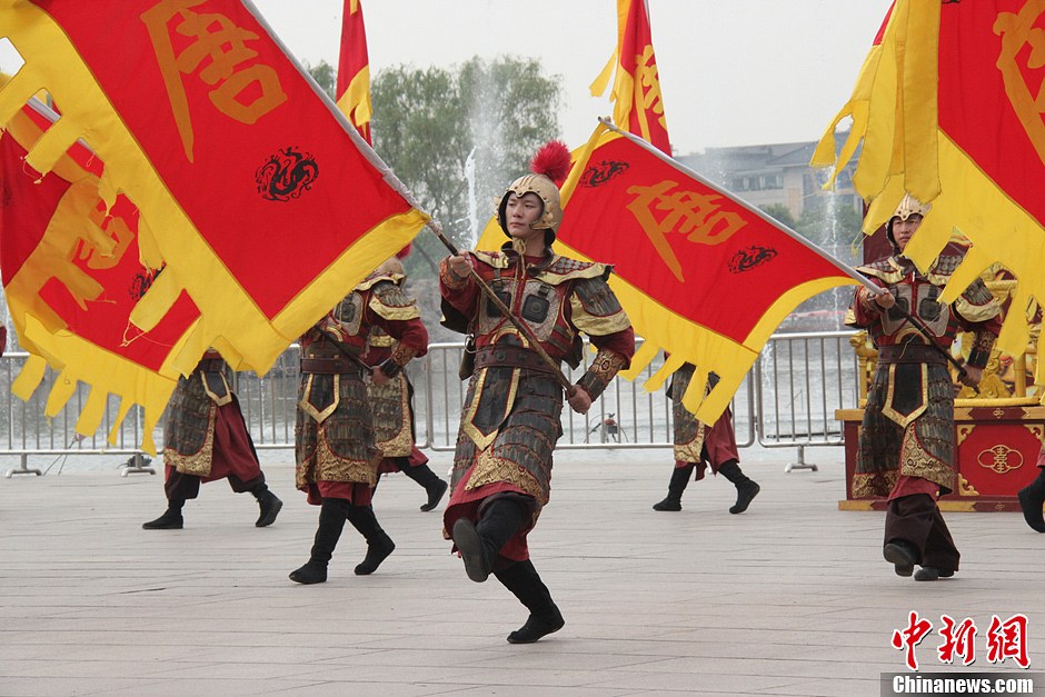 Men in costumes of soldiers in Tang Dynasty (618-907) attend a ceremony for celebrating the Flouring Period of the Tang Dynasty (618-907) in Xi'an, Shaanxi Province, May 1, 2013. The Flourishing Period, spanning from the Zhenguan Era (627-649) to the Tianbao Era (742-756), was the heyday of the Tang Dynasty as well as one of the most prosperous periods in China’s feudal history. (CNS/Dai Haofan)