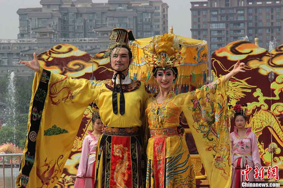 A man in the costume of Tang Ming Huang (also known as Emperor Xuanzong) and a woman in the costume of Yang Guifei, who was the beloved consort of Emperor Xuanzong and was one of the Four Beauties of ancient China, attend a ceremony for celebrating the Flouring Period of the Tang Dynasty (618-907) in Xi'an, Shaanxi Province, May 1, 2013. The Flourishing Period, spanning from the Zhenguan Era (627-649) to the Tianbao Era (742-756), was the heyday of the Tang Dynasty as well as one of the most prosperous periods in China’s feudal history. (CNS/Dai Haofan)