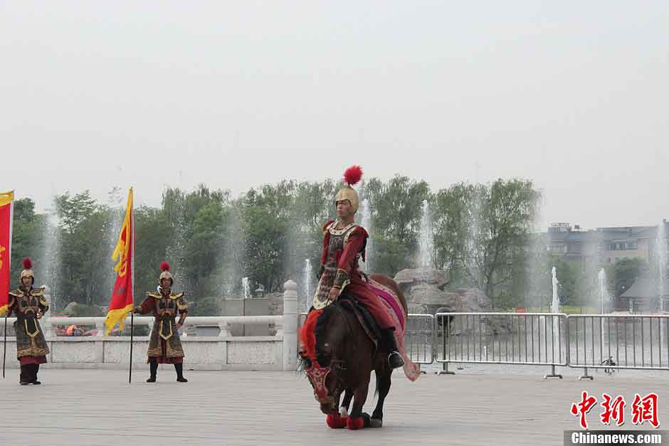 Men in costumes of soldiers in Tang Dynasty (618-907) attend a ceremony for celebrating the Flouring Period of the Tang Dynasty (618-907) in Xi'an, Shaanxi Province, May 1, 2013. The Flourishing Period, spanning from the Zhenguan Era (627-649) to the Tianbao Era (742-756), was the heyday of the Tang Dynasty as well as one of the most prosperous periods in China’s feudal history. (CNS/Dai Haofan)