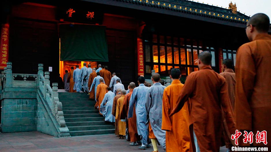 Monks line up to go to the meditation room. (CNS/Liu Zhongjun)