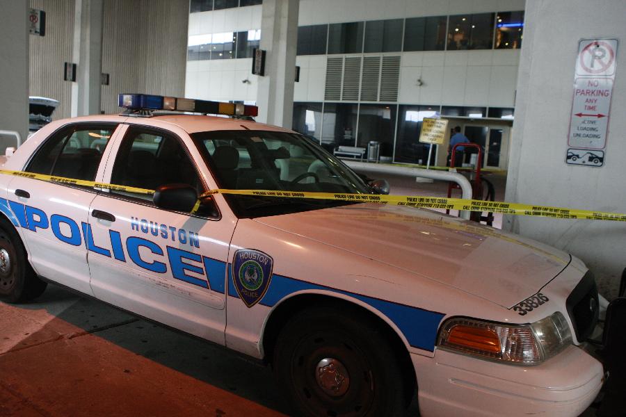 A police car is seen outside the Terminal B at the Bush Intercontinental Airport in Houston, the United States, May 2, 2013. Shots were fired Thursday at an airport in the U.S. state of Texas, a local TV station reported. (Xinhua/Song Qiong) 