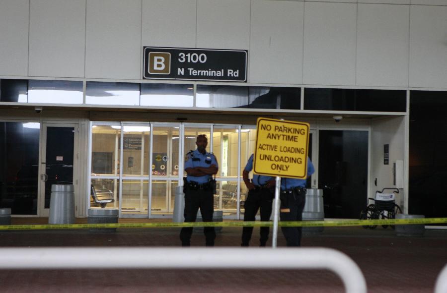 Police guard outside the Terminal B at the Bush Intercontinental Airport in Houston, the United States, May 2, 2013. Shots were fired Thursday at an airport in the U.S. state of Texas, a local TV station reported. (Xinhua/Song Qiong) 