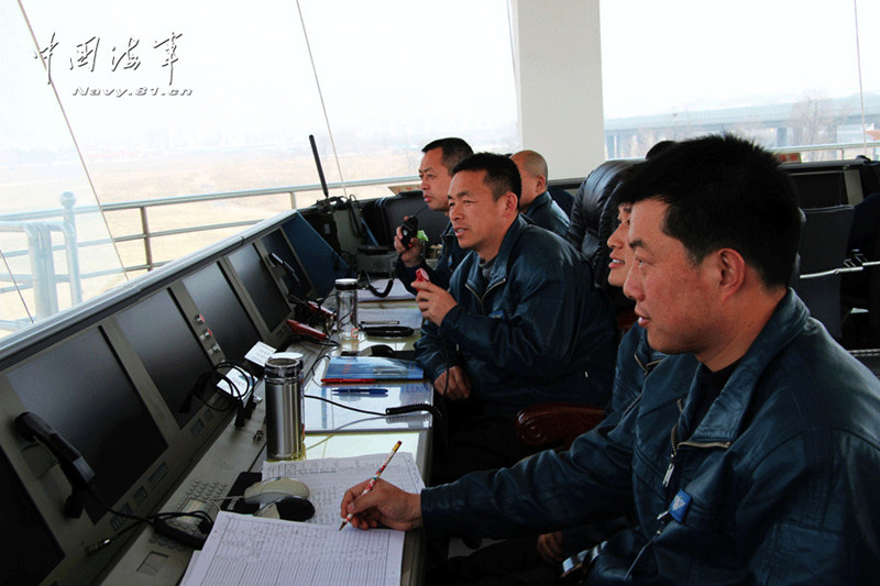 Multiple types of ship-borne helicopters of the aviation force under the North China Sea Fleet of the Navy of the Chinese People's Liberation Army (PLA) carried out the collaborative anti-submarine drills in the Yellow Sea under complicated weather conditions.  (China Military Online)